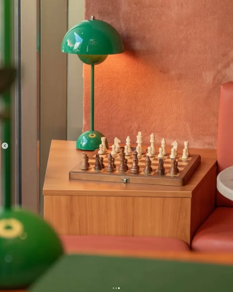 Chess board under a green lamp